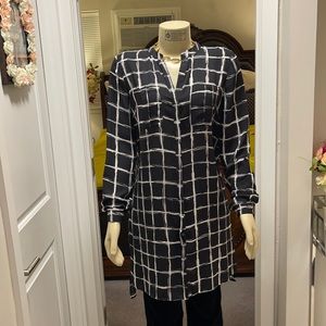 Long black tunic top with white stripes.